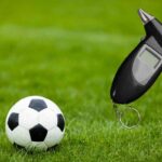cancha de futbol y alcoholímetro